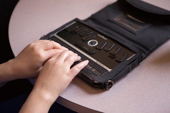 Closeup of hands on the notetaker