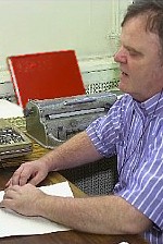 A proofreader checking the quality of a braille document