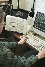 A braille transcriber working at her computer