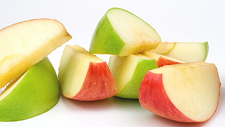 Photo of slices red and green apples