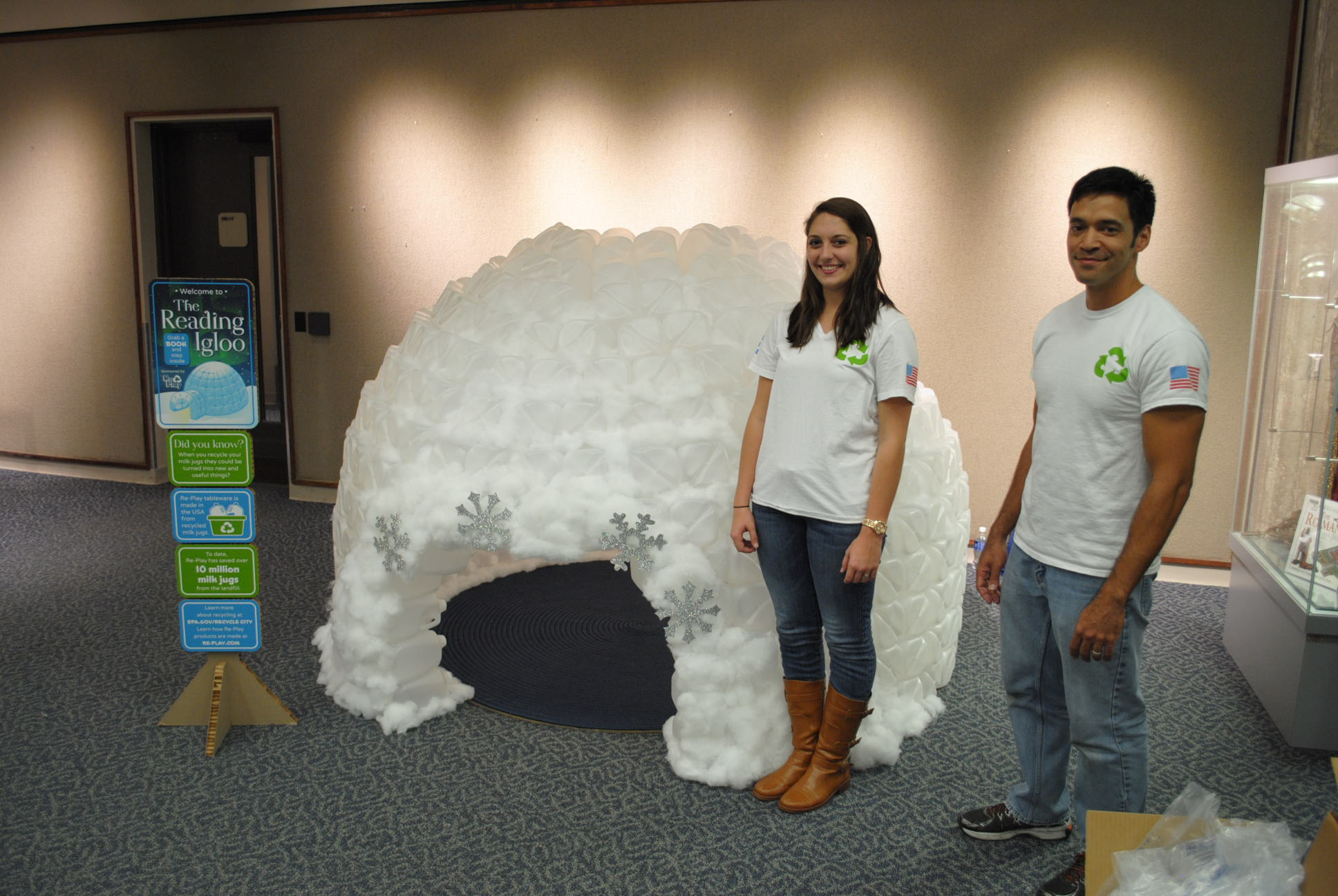 teacher and class building a milk-jug igloo