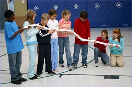 Teacher and class hold up the marble run