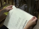 Collated braille pages bound as a volume with a stitch binding