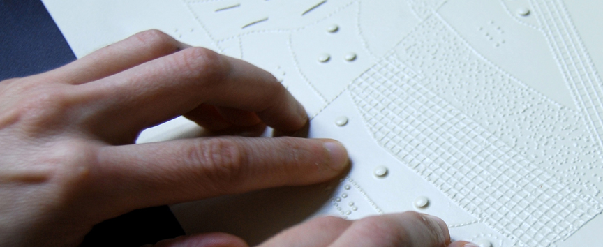 Close-up image of hands reading a tactile graphic.