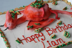Photo of a dragon cake with tacos on its belly