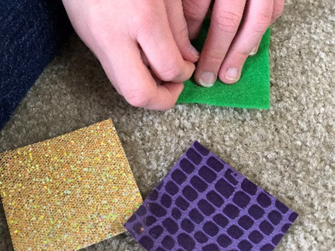 hands with different fabric scraps