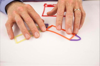 Chris's hands creating room design using wax sticks