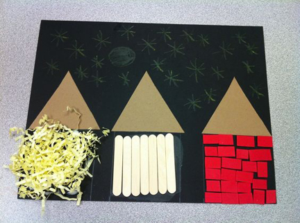 Photo of a tactile drawing, made by child, of Three Little Pigs houses