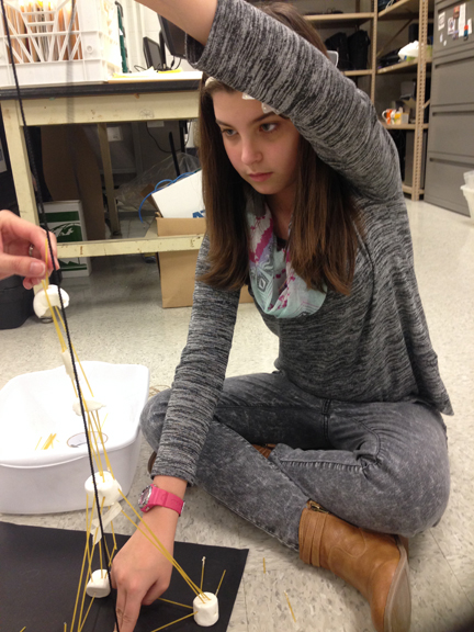 Girl building a tower