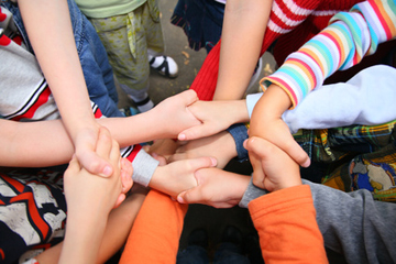 bunch kids' arms and hands for the knot