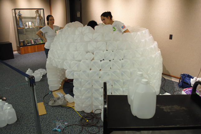 teacher and class building a milk-jug igloo