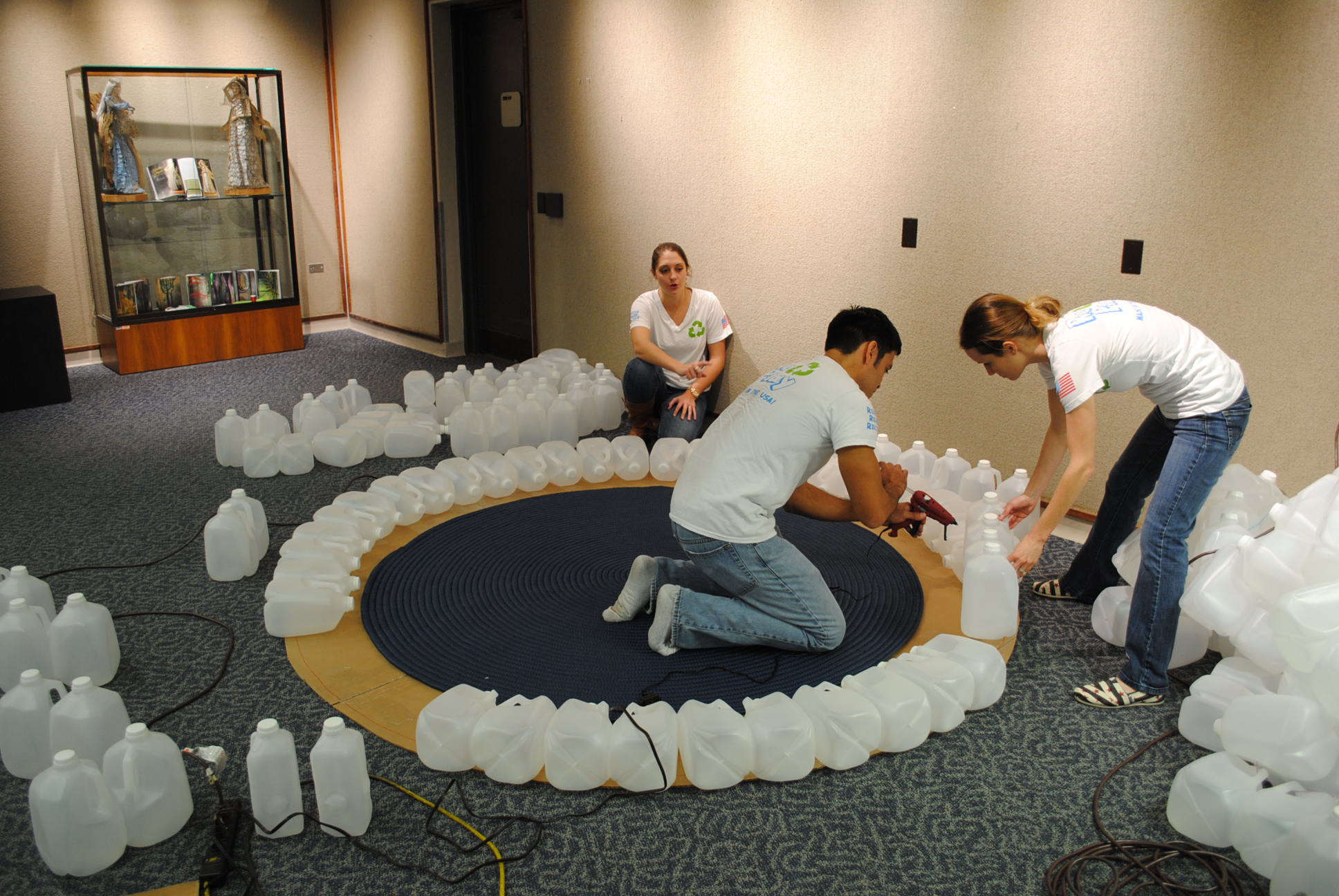 teacher and class building a milk-jug igloo