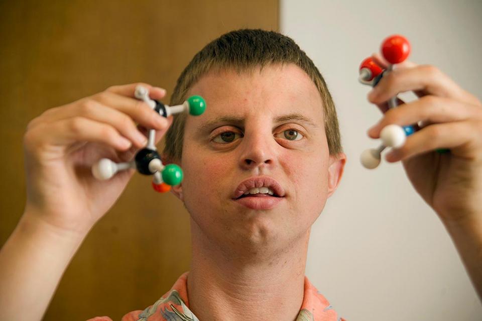 photo of Hoby holding models of molecules